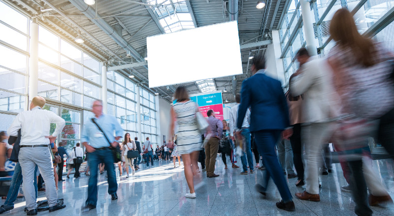 people walking at conference