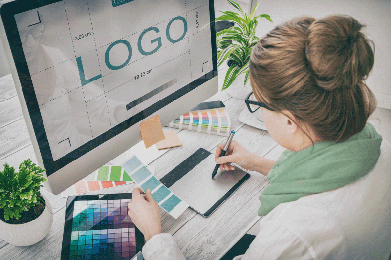 Designer working on computer to design a logo