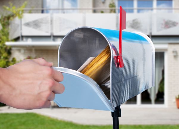 Hand opening mailbox with mailers inside