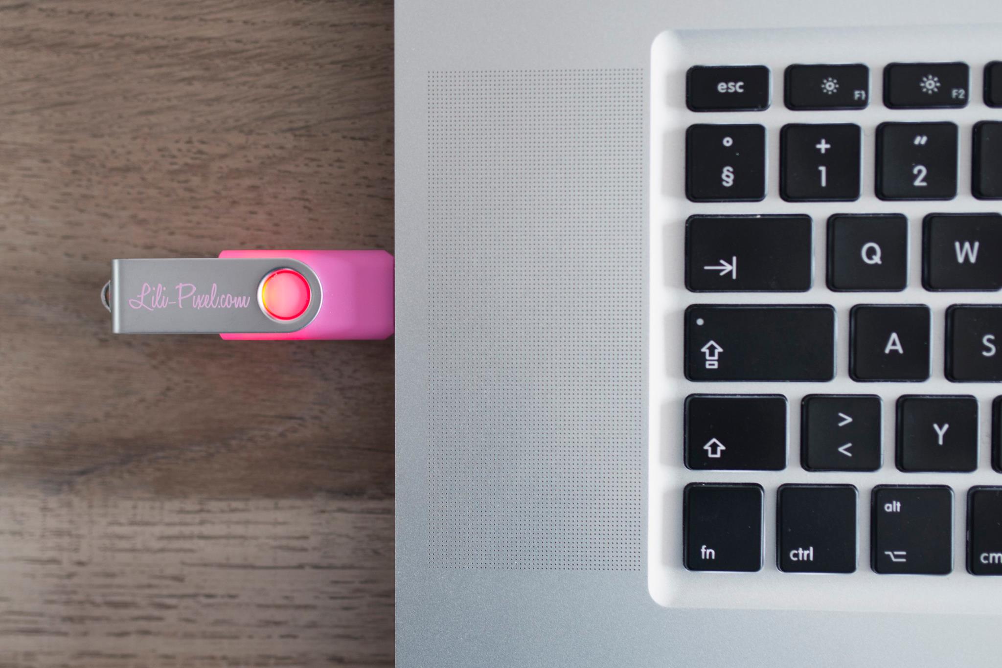 Our SWM Custom Flash Drive in a custom pink with solid print